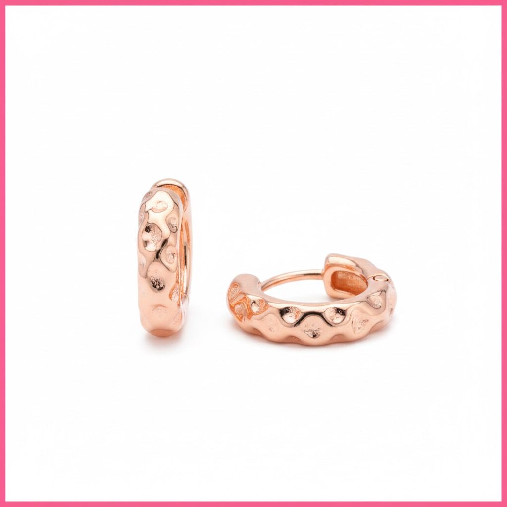 Rose gold hoop earrings on a white background