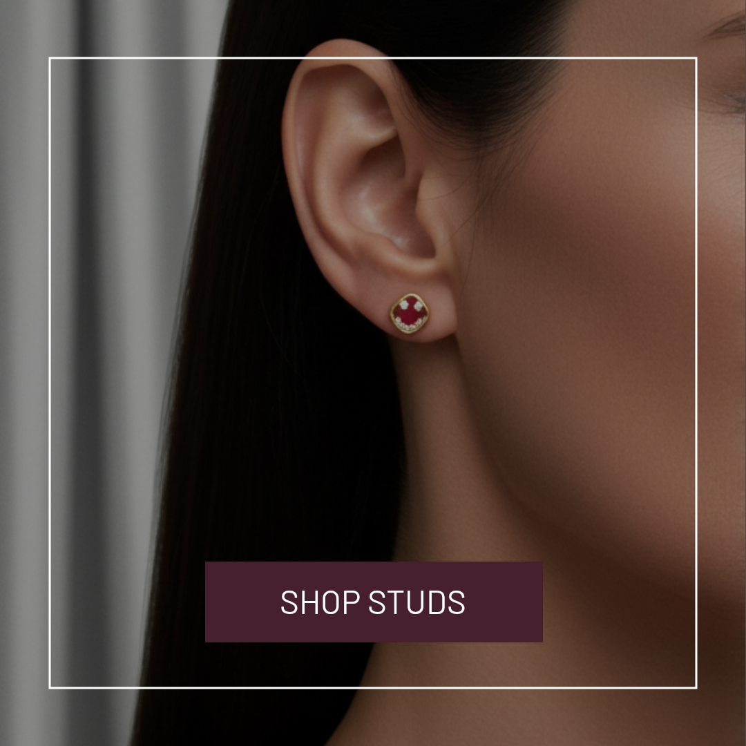Earring worn by a person with a 'Shop Studs' button below.